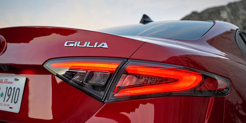 Rear view of a red Alfa Romeo Giulia showing the LED taillight